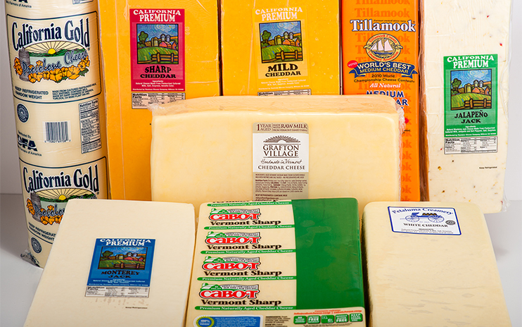 Blocks of cheese in wrappers